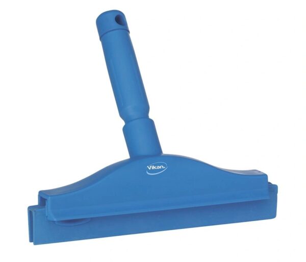 A blue squeegee is sitting on top of the floor.